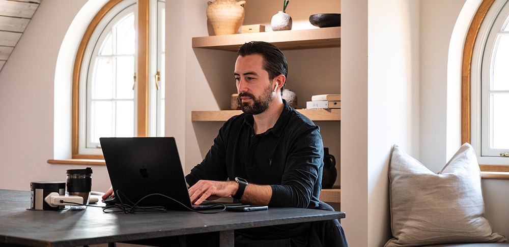 Man sitting at his laptop in the Boathouse co-working space