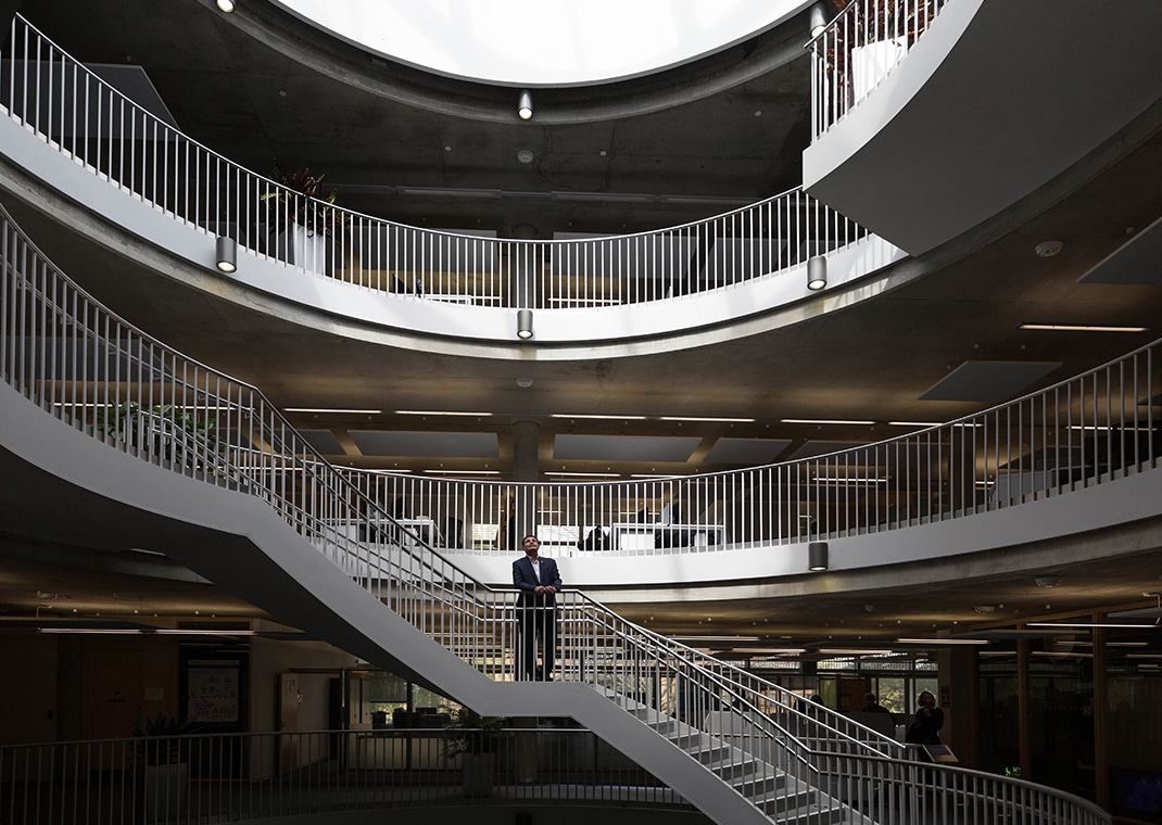 Man at bottom of spiral staircase