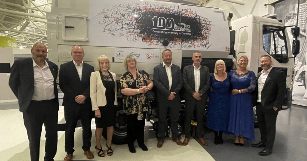 Bucher staff and guests at the centenary celebration at the British motor museum