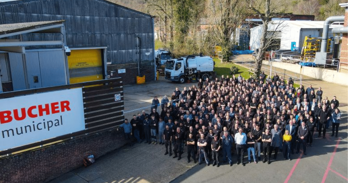 an external shot of the business premises with all staff standing in front.