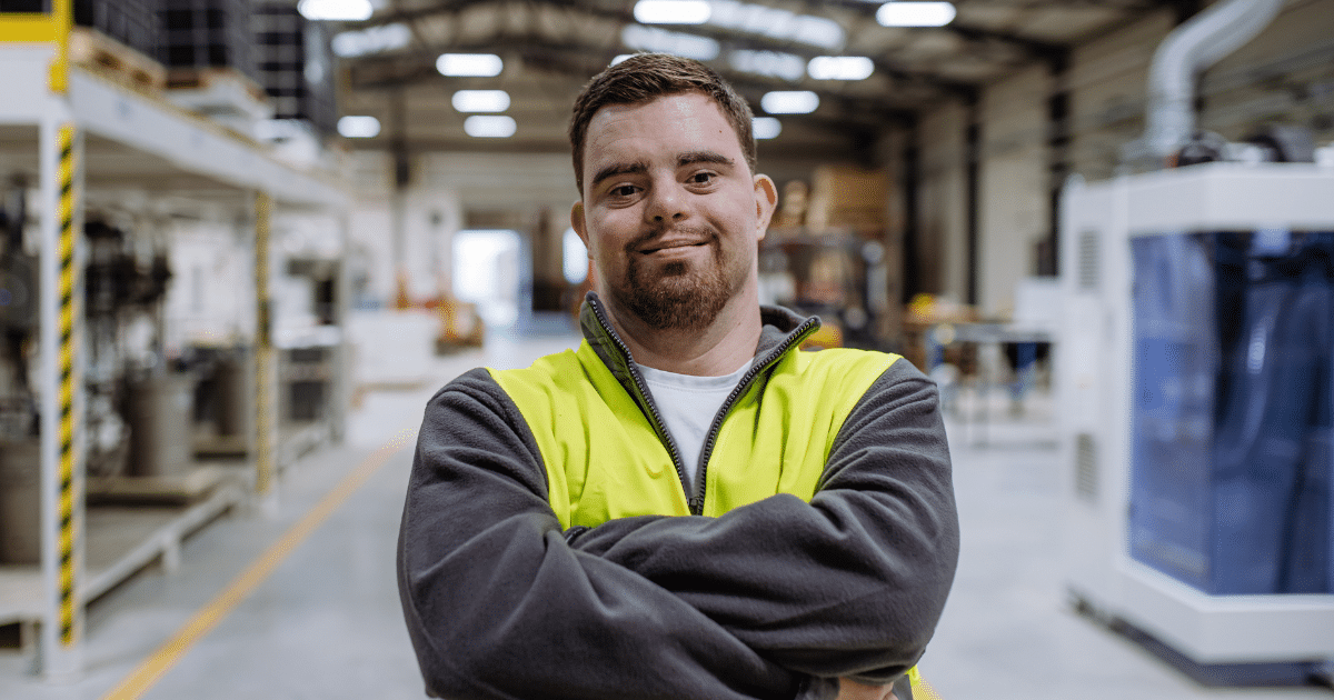 connect to work can help solve your recruitment challenges - man stands in warehouse, ready to work