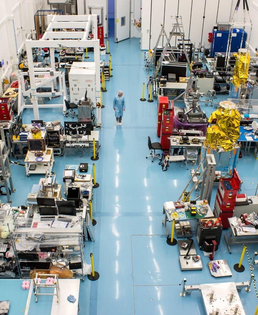 Aerial shot of a space satellite assembly production line in Surrey