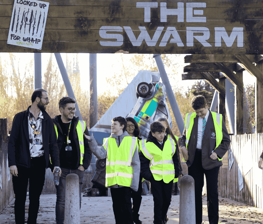 students and staff walk through Thorpe Park as part of a work experience visit