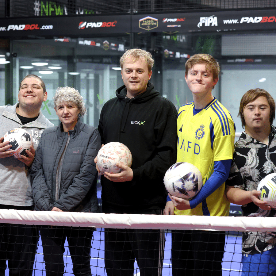 students and staff taking part in work experience visit to a Surrey football venue.