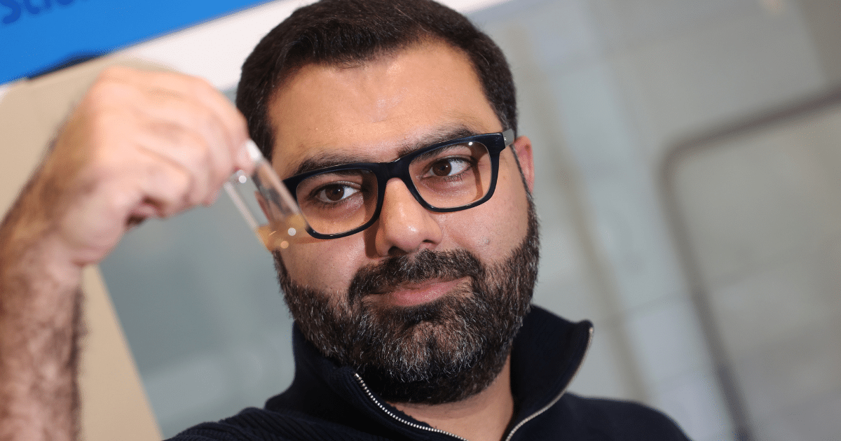 Mantisonix - Dr Zare examines a test tube of chemicals | Mantisonix forever chemicals technology | Economic Growth Fund | Business Surrey
