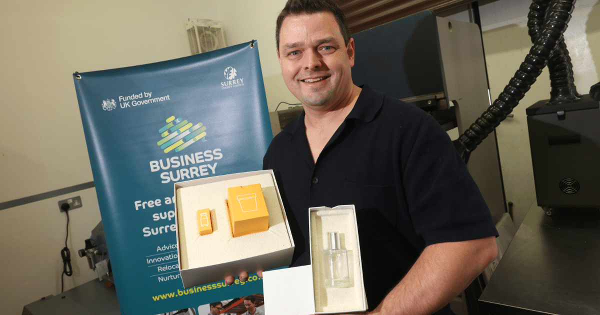 Rob shows his packaging - standing in his workshop | Business Surrey | Woven Bio |